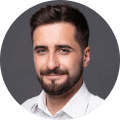 Dairk haired man with beard smiling